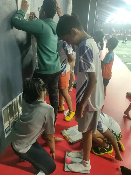 Our team carefully records measurements to track the physical progress of each young athlete in our program.