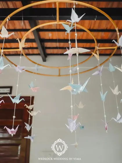 A beautiful hanging mobile made of delicate origami birds in pastel shades. This was a central decor piece for a Mehendi, adding a touch of handcrafted charm and whimsy.