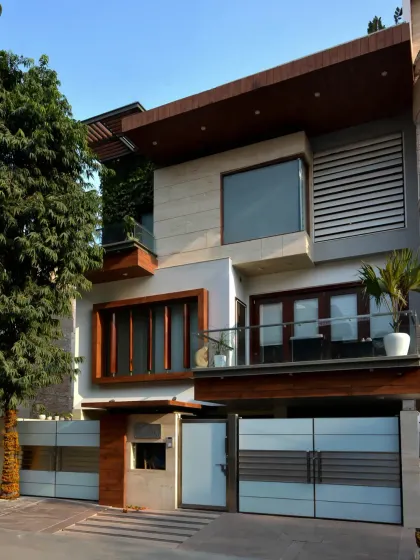 The Gupta Residence in Punjabi Bagh is designed for three generations. The elevation is a composition of interlocking blocks, creating multiple terraces that encourage outdoor interaction and optimize natural light on the north-west facing site.