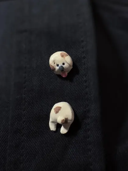 A playful two-part pin set of a spotted dog's head and tail. This is another example of the unique, wearable art I create for my animal-themed collection.