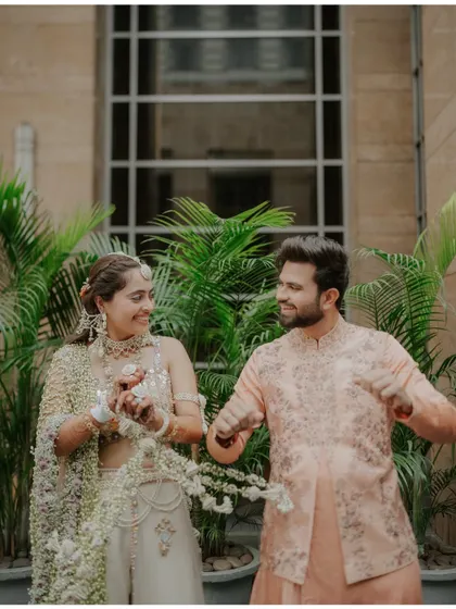 A candid shot of the couple dancing and laughing together, their happiness being the central focus of the frame.