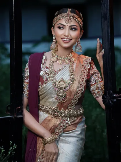 Another beautiful shot of the bride, showcasing the complete look from the maang tikka to the detailed saree. This is the kind of portfolio-worthy shot you will learn to create.
