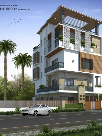 This multi-level residence design incorporates large jalli screens on the upper floor for privacy and sun shading. The combination of white walls, wood accents, and lush balcony planters gives it a fresh, tropical modern feel.