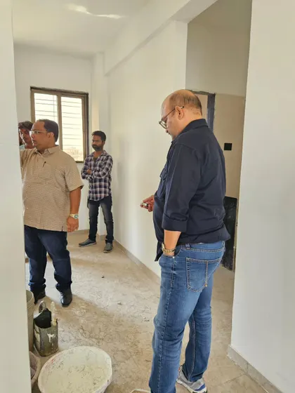 Inspecting a hallway in a client's home. Even transitional spaces need to have a clear and positive energy flow to connect the rooms harmoniously.