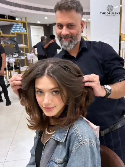 Flawless hair, flawless confidence. This mid-length cut with voluminous, bouncy layers is a head-turning transformation that exudes style.