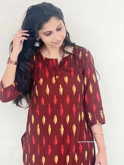 A close-up of the beautiful maroon Ikat fabric. You can see the detail and craftsmanship in every thread of this pure cotton handloom kurta.