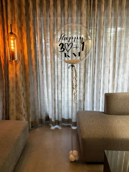 Sometimes simple is best. This single, elegant personalized balloon for a "30+1" birthday makes a chic and modern statement in any space.