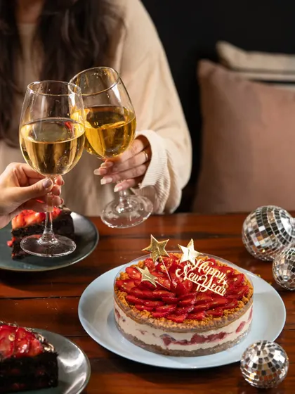 There's nothing like toasting to a new year with good company and a delicious cake. Our Strawberry Biscoff Cheesecake is the perfect centerpiece for any New Year's Eve party.