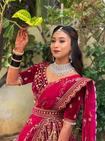 Another beautiful shot of Pallavi's reception look. The half-up hairstyle keeps the hair away from the face while still showing off its length and texture.