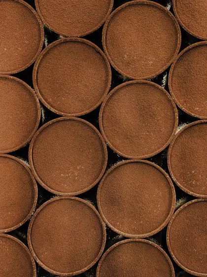 A beautiful, satisfying shot of our Tiramisu cups, all dusted with cocoa and ready to be sent out to our stores.