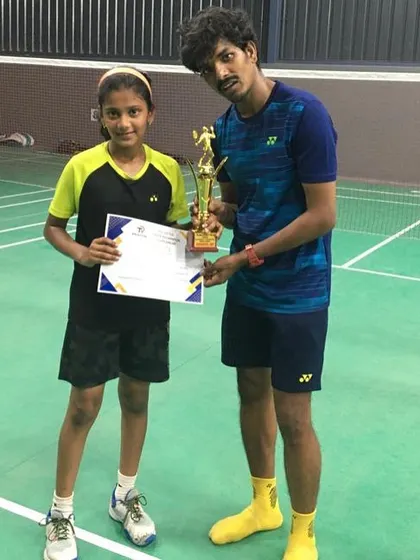 Celebrating Ananya R.'s first-ever trophy, a second-place finish at the Junior Badminton Tournament by Battleminton.