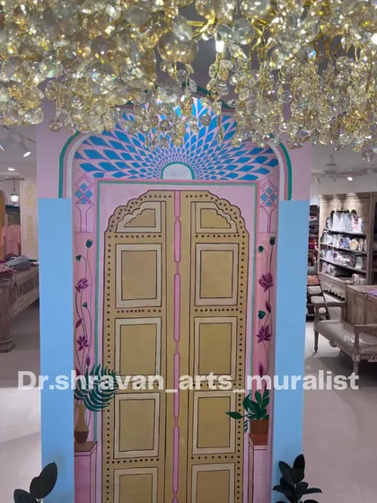 This Jaipur door was painted on canvas for a clothing store in Indiranagar. It serves as a beautiful, themed photo-op backdrop that enhances the store's brand identity.