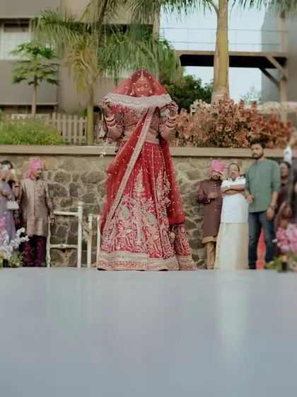 The bride's anticipation is palpable as she waits for the veil to be lifted during the ceremony.
