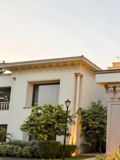 This neo-classical farmhouse is a serene sanctuary boasting multiple decks, sit-outs, and relaxation spaces thoughtfully designed to immerse you in tranquility.
