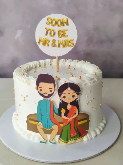 A sweet cake for a couple who is "Soon to be Mr & Mrs". This design features a cute caricature, perfect for an engagement party or intimate celebration.
