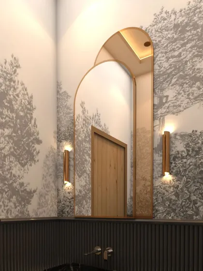 A stunning arched mirror framed in gold serves as the centerpiece, set against a nature-inspired wallpaper that adds a touch of serenity.