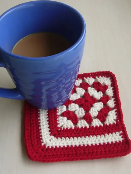 A classic red and white granny square coaster, just the right size for a cup of coffee. These are quick to make and are a great beginner project.