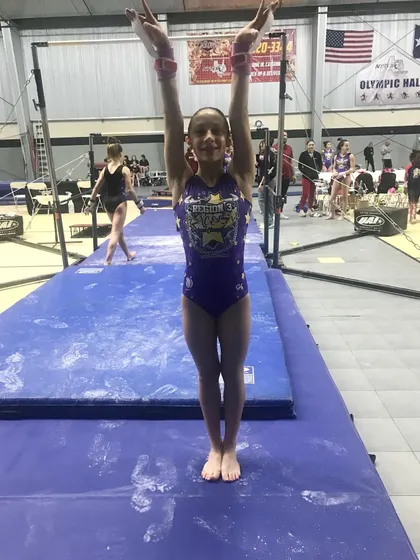 Another one of our talented Diamond gymnasts, ready for her bars routine at regionals.