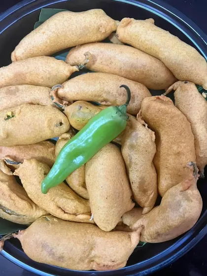 Crispy Mirchi Vada, a spicy and flavorful snack perfect for a weekend indulgence. This was part of a larger curated meal platter, designed to bring a variety of tastes and textures to your gathering.