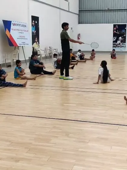 Young players doing floor exercises as part of their fitness training, a crucial element for all age groups.