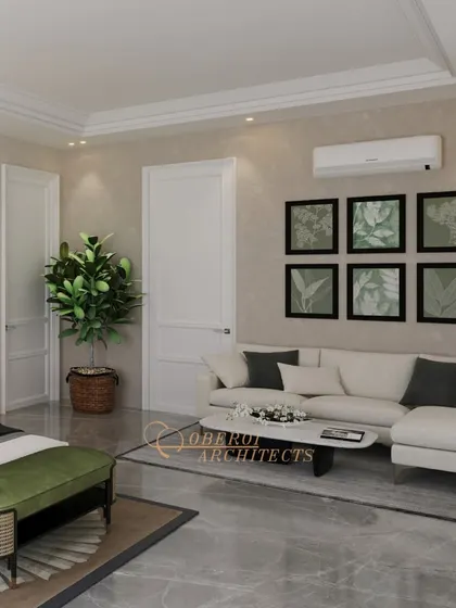 The room includes a comfortable sofa and botanical artwork, creating a relaxed seating area that complements the bedroom's earthy and elegant theme.