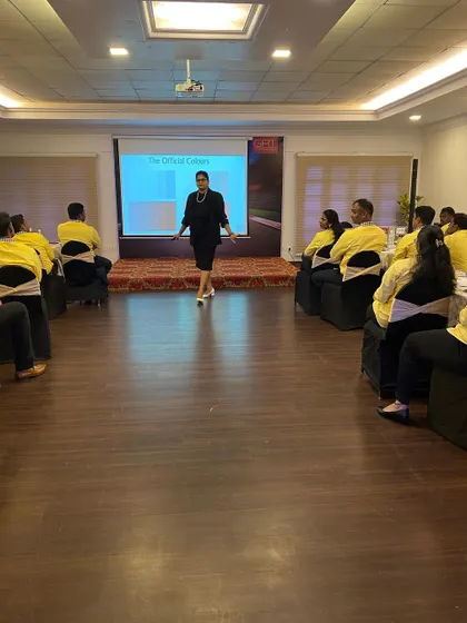 A wide view of my training setup for a corporate workshop. I ensure the environment is comfortable and conducive to learning, allowing for both group discussion and individual reflection on topics like business etiquette and professional grooming.
