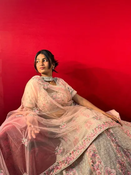 This beautiful pastel pink ghagra is a favourite for bridesmaids and wedding guests who want a soft and elegant look.