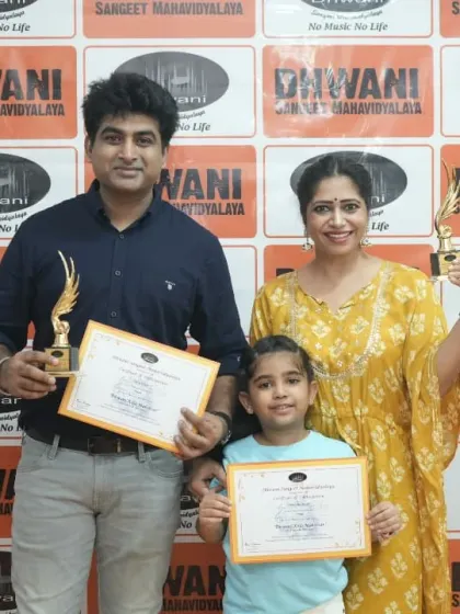 A family of musicians. A student and her father, both award winners, with the youngest member of the family.
