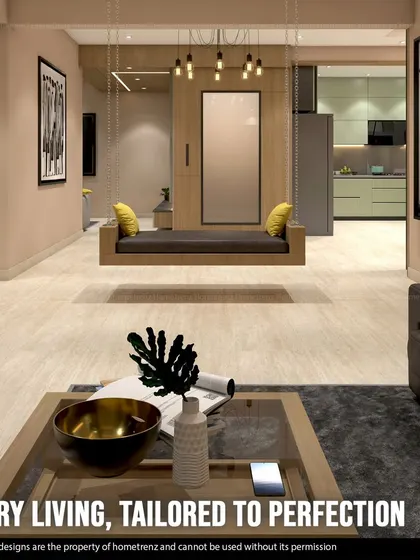 I believe in luxury living, tailored to perfection. This open-concept space features a statement indoor swing, a comfortable leather sofa, and a clear view into the modern kitchen, creating a cohesive and stylish home.