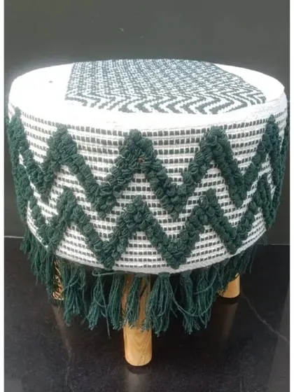This green and white zig-zag macrame stool is a fresh and modern piece. The deep green color adds a touch of nature-inspired elegance.
