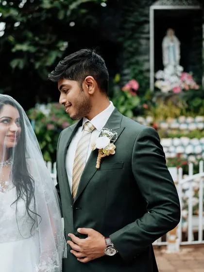 In front of a statue of Mother Mary, this Catholic couple shares a quiet moment of reflection before their vows. This image highlights my experience in capturing the serene and faith-filled moments of a church wedding.