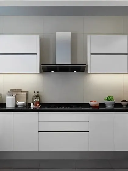 A modern U-shaped kitchen with a striking black and white contrast. The glossy white cabinets are paired with a black countertop and appliances, creating a sleek and contemporary aesthetic.