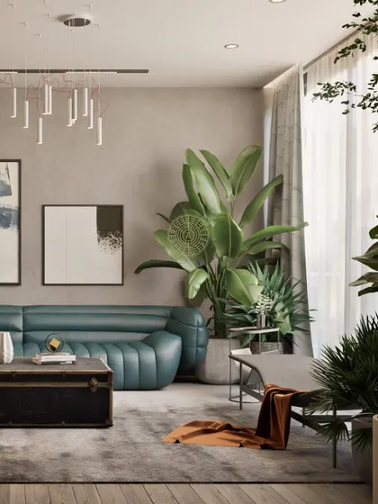 This view highlights the layered and earthy feel of the living room. The green sofa, vintage trunk, and abundant plants create a space that is both stylish and deeply comfortable.