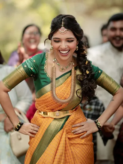 That joyful smile says it all. Our bride Jothi having the time of her life during her engagement ceremony in her custom manSi outfit.