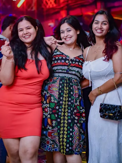 Three friends enjoying the music and the moment. It's all about creating memories with the people you care about.