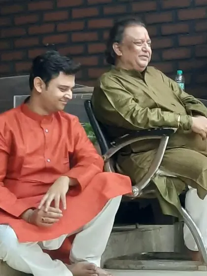 A candid moment between Guru and son, Pt. Jai Kishan Maharaj ji and Tribhuwan Maharaj, at the 'Sadhana Mahotsav'.