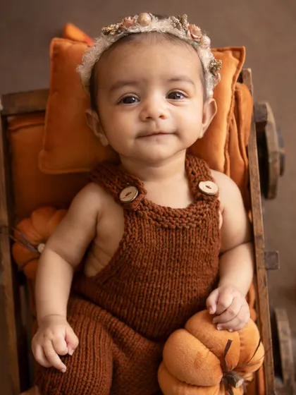 A soft, gentle smile. This close-up shot captures the sweet and innocent expression of this 3-month-old.