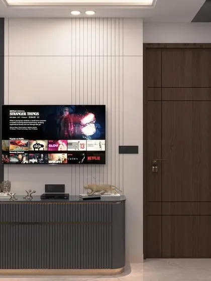 A render of a modern bedroom in Munirka, showing the TV unit with a fluted grey console. The design is minimalist and chic.