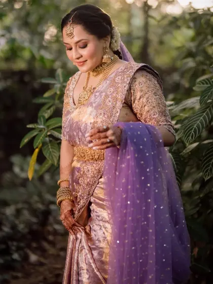 The bride looking down at her hands, a moment of quiet contemplation on her wedding day.