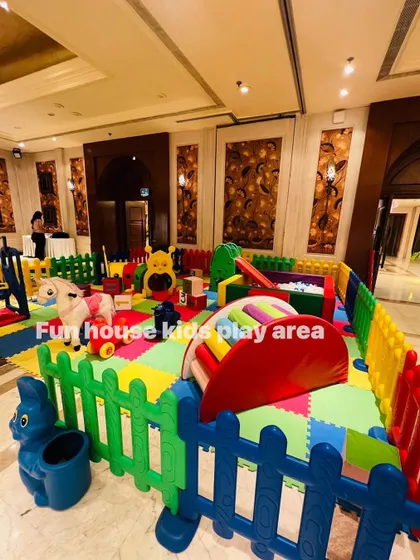 A wide shot of the rainbow play area in a grand hotel ballroom, showing how we can bring color and fun to any location.