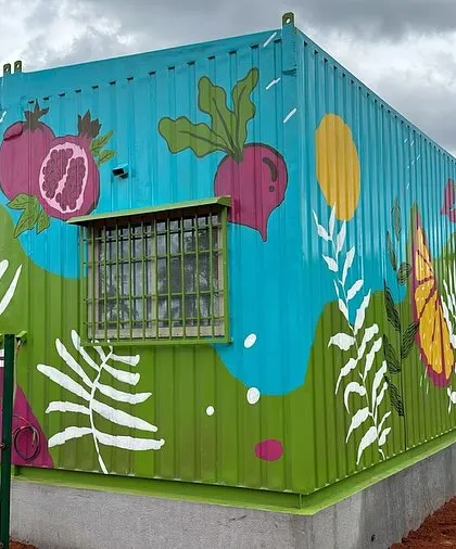 I painted this entire shipping container for an upcoming supermarket. The corrugated surface and outdoor elements were challenging, but the final result is a burst of color that can't be missed.