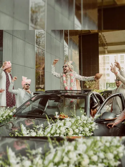 The groom's energetic baraat, arriving in a car decorated with flowers.