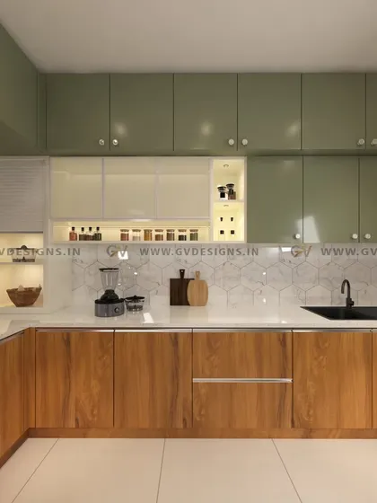 Our "Oasis of Olive" kitchen design uses a beautiful olive green laminate on the wall cabinets, contrasted with a teak wood finish on the base units. The design is complemented by a hexagonal tile backsplash and lacquered glass shutters.