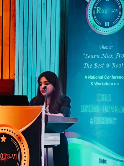 Speaking at the podium during the Roots 2023 conference. I am grateful for the opportunity to train others in hair transplantation techniques.