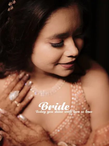 A beautiful close-up portrait of the bride on her engagement day, highlighting her joy and elegant jewelry.