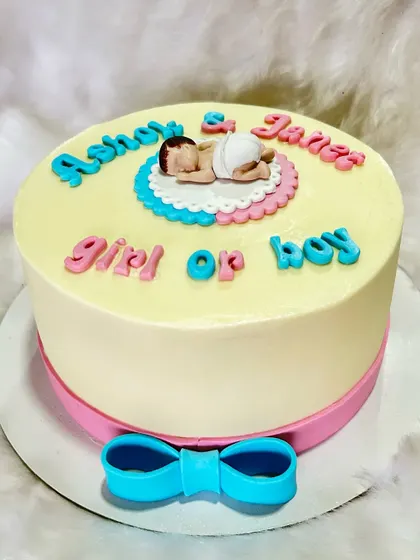 A sweet "Girl or Boy?" gender reveal cake. This vanilla blueberry cake traveled 30km to the baby shower and arrived perfectly, much to the client's delight.