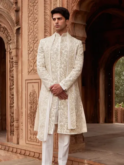 Menswear, in my view, should be about quiet confidence and impeccable detail. This ivory sherwani set is a masterclass in understated elegance, featuring intricate hand-embroidery that adds texture and depth without overwhelming the clean, tailored lines. It is perfect for the groom who values refined craftsmanship.