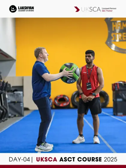 An instructor demonstrates a medicine ball throw, teaching participants how to coach for rotational power and core strength on Day 4.