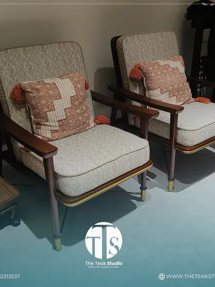 Another view of our comfortable and stylish chair set. The patterned fabric and solid wood frame with brass-tipped legs create a look that is both classic and contemporary.