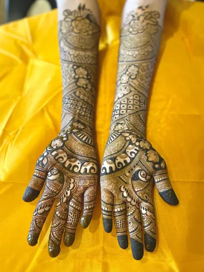 A duplicate image of the full-arm bridal design with elephant motifs.